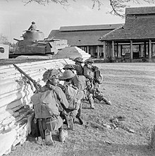 Troops of the 19th Indian Division and a Lee tank in action during street fighting in Mandalay, 9-10 March 1945. The British Army in Burma 1945 SE3271.jpg