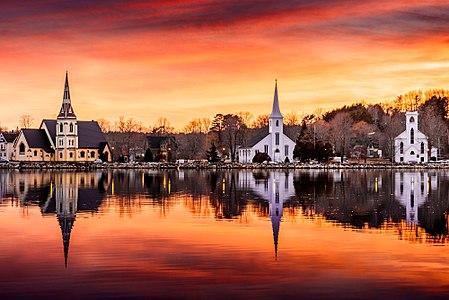 The three iconic churches in Mahone Bay,Nova Scotia at sunset.