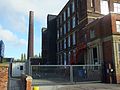 English Fine Cotton's Tower Mill, Park Road, Dukinfield. In 2015 this 1885 mill, designed by Potts for Christian Koch was chosen as the new manufacturing site for English Fine Cotton. The company is investing £4.8m with a £1m grant from the Textile Growth Programme to restart cotton production in Manchester for the first time since the 1980's. The mill will use new technology and produce cotton for high value. Behind in the Clarence Mill chimney