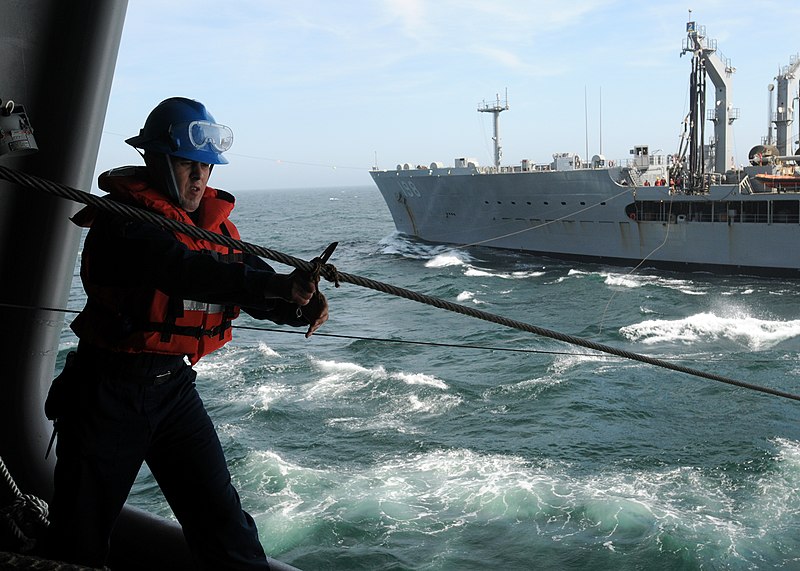 File:US Navy 100407-N-9116S-279 Boatswain's Mate 3rd Class Stephen J. Markman removes the stopper line during an underway replenishment.jpg