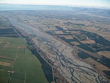 Floodplain (centre) within the alluvial plain of the Waimakariri River, New Zealand (part of the Canterbury Plains). Waimakariri02 gobeirne.jpg