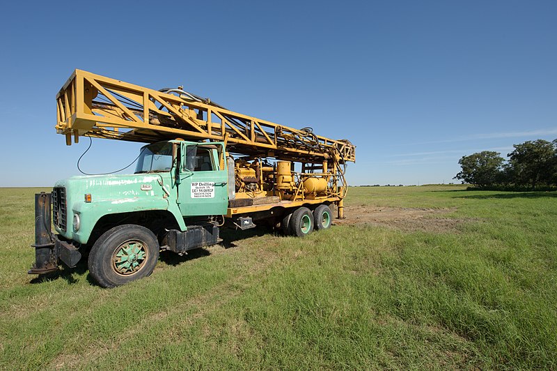 File:Well drilling truck preparing to set up for drilling livestock water well at Walking M Ranch in Baylor County, Seymour, Texas. (24821764220).jpg