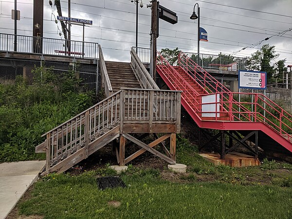 Stairs leading to the platform of the West Baltimore station in May 2019; the two sets of stairs on each side on the station are the entrances to the 