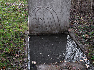 Ian Hamilton Finlay sculpture in Stuttgart, 1975; the word schiff (ship) is carved in reverse and can only be decoded when reflected on water 0256-Stuttgart Finlay-11-02.jpg