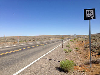 First reassurance shield along eastbound SR 140 after crossing the Oregon border 2014-07-06 16 04 23 First reassurance sign along eastbound Nevada State Route 140 (Adel Road) about 0.1 miles east of the Oregon border in the Sheldon National Wildlife Refuge, Nevada.JPG