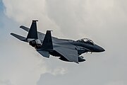 An F-15E Strike Eagle, tail number 91-0313, taking off from RAF Lakenheath in England. The aircraft is assigned to the 494th Fighter Squadron.