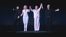 ABBA appearing in a pre-recorded curtain call at the end of a ABBA Voyage concert.