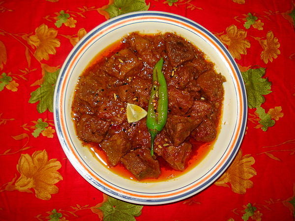 Achar gosht, a meat curry cooked with flavors borrowed and amalgamated from pickle