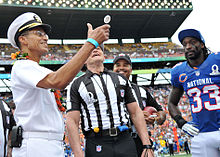 Calling a coin toss to determine which team will take the offense at a sporting event is a paradigm case of a guess that requires minimal consideration of forces influencing the outcome. Adm. Haney flips the coin at the Pro Bowl.jpg