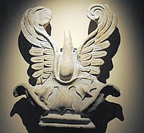 A sculpture known as a "palmette antefix" displaying large leaf fronds