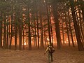 A firefighter watches impeding flames on August 7, 2021.