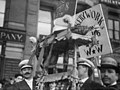 Bakery Workers Union Local 46, IWW (Industrial Workers of the World) sign and Hebrew language sign in New York City parade participants holding aloft a loaf of bread on May 1, 1908 - LCCN2014680338 (cropped).jpg