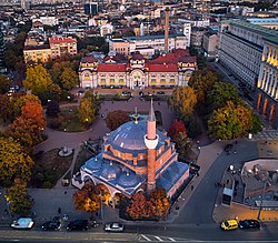 The 16th-century Banya Bashi Mosque is located in the centre of the capital Sofia right next to several churches and the Sofia synagogue and adjoins the buildings of the Council of Ministers and the Presidency. Banya Bashi Mosque (37849692391).jpg