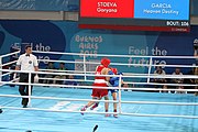 Deutsch: Boxen bei den Olympischen Jugendspielen 2018 Tag 12, 18. Oktober 2018 - Kampf um die Bronzemedaille im Fliegengewicht Mädchen – Heaven Destiny Garcia (USA, blau) schlägt Goryanana Stoeva (Bulgarien, rot) 5-0; Ringrichter ist Ishanguly Meretnyyazov (Turkmenistan). English: Boxing at the 2018 Summer Youth Olympics on 18 October 2018 – Girl's flyweight Bronze Medal Bout - Heaven Destiny Garcia (USA, blue) beats Goryanana Stoeva (Bulgaria, red) 5-0; Referee is Ishanguly Meretnyyazov (Turkmenistan). Español: Boxeo en los Juegos Olímpicos Juveniles de Verano de 2018 en 18 de octubre de 2018 - Combate a medalla de bronce de peso mosca para mujeres: Heaven Destiny Garcia (Estados Unidos, azul) le gana a Goryanana Stoeva (Bulgaria, roja) 5-0; El árbitro es Ishanguly Meretnyyazov (Turkmenistán).