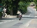 Unknown rider approaching Crosby Crossroads during the Junior Supersport B TT race in 2008