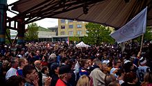 Crowd under the canopy in the Forks Market Plaza Crowds in Winnipg gather for announcement of relocation of Thrashers NHL franchise to Manitoba.jpg