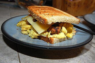 Sausage, egg and cheese sandwich Egg and cheese breakfast sandwich.jpg