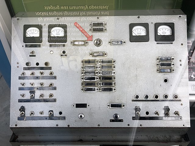 Explorer 1 launch control console on display at Huntsville Space and Rocket Center. The red arrow points to the manually turned launch key switch.