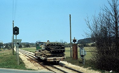 A Train and cart, wagon with cargo.