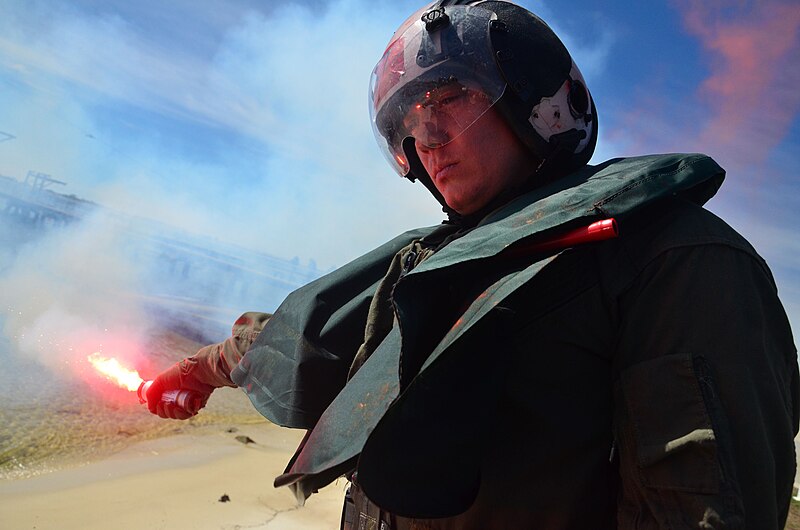 File:Flickr - Official U.S. Navy Imagery - An officer lights a flare during training..jpg