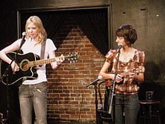 Micucci performing as Garfunkel and Oates with Riki Lindhome at Upright Citizens Brigade Theatre in New York City, February 2009