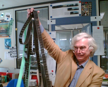 George Auckland looking through a reel of tape in the BBC Interactive Factual & Learning Innovations Hub, 22 May 2006. George Auckland BBC.png