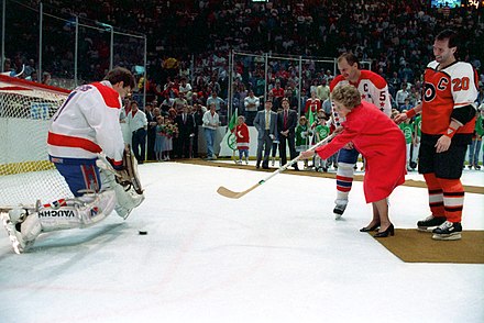 First Lady Nancy Reagan shooting a puck against Washington goaltender Pete Peeters while attending a Capitals-Flyers game in 1988.