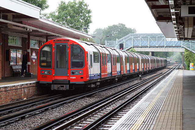 A Central line 1992 stock train leaving Theydon Bois