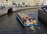 The motorboat Merkury-5, («Меркурий-5»), Takelazhnitsa Class, goes from the Moyka River to the Winter Canal and approaches the Second Zimny bridge. 2014.