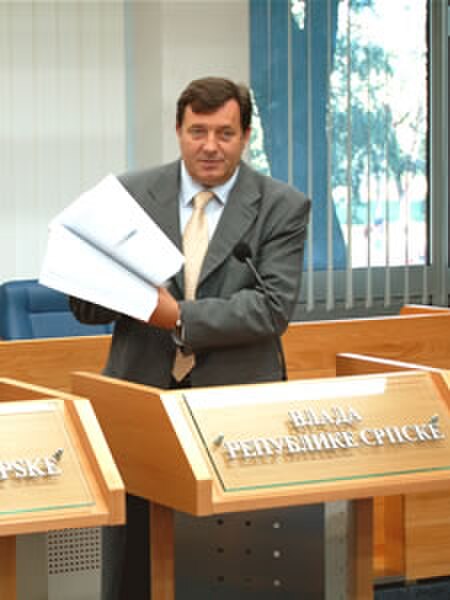 Dodik demonstrates the amount of paperwork reduced by USAID-supported reforms, April 2007