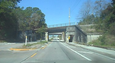 Bridge for the main line of the St. Johns River Terminal Railroad over US 23 in Grand Park, Jacksonville. NB US 23 Under St Johns River Terminal Railway Bridge.jpg