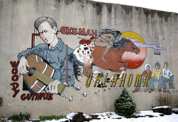 Mural by DeAnna Mauldin, depicting Woody Guthrie and Okfuskee County history, 510 W. Broadway, Okemah