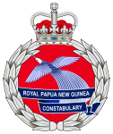 The emblem of the Royal Papua New Guinea Constabulary featuring featuring the Crown