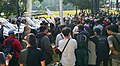 Protestors enter the grounds of the House of Representatives after the right gate was broken down during a demonstration on the regional election bill