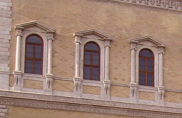 Open pediments on windows at the Palazzo Farnese, Rome, by Antonio da Sangallo the Younger, begun 1534