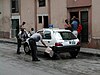 A Cuban police car in Havana, Cuba, getting washed by Cuban policemen, photographed in May 2002