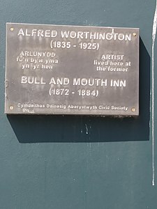 Plac i'r arlunydd Alfred Worthington ar ochr mur Amgueddfa Ceredigion ar Stryd Portland