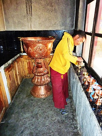 Preparing butter lamps at Takthok Monastery. 2010 Preparing butter lamps at Thag-Thok Gompa. 2010.jpg