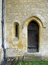 12th-century priest's door and low window of the parish church at Guiting Power, Gloucestershire Priest's door.jpg