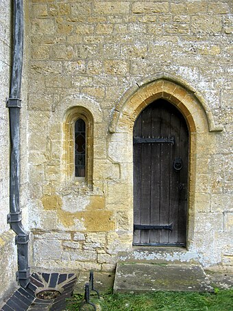 12th-century priest's door and low window of the parish church at Guiting Power, Gloucestershire