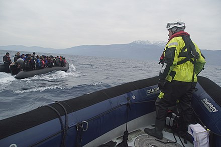 Migrants crossing the Mediterranean Sea on a boat, heading from the Turkish coast to the northeastern Greek island of Lesbos, 29 January 2016