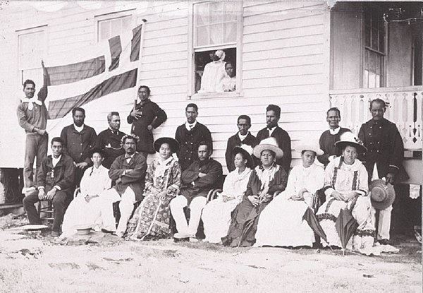 The Royal Family of Raiatea in the 1880s, when Raiatea became a French Protectorate. In the background, holding the flag, is Teraupo.