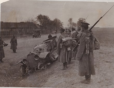 Imperial Russian Army soldiers inspect an auto wreckage, 1915