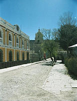 Administration building and church in the Plaza de Arma in Salinas de Garcí Mendoza