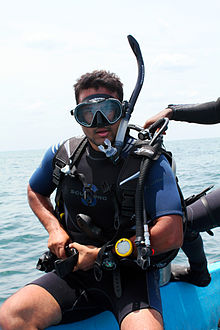 Recreational diver putting on his scuba set before diving Scuba Diver - Ahmad Faiz Mustafa.jpg