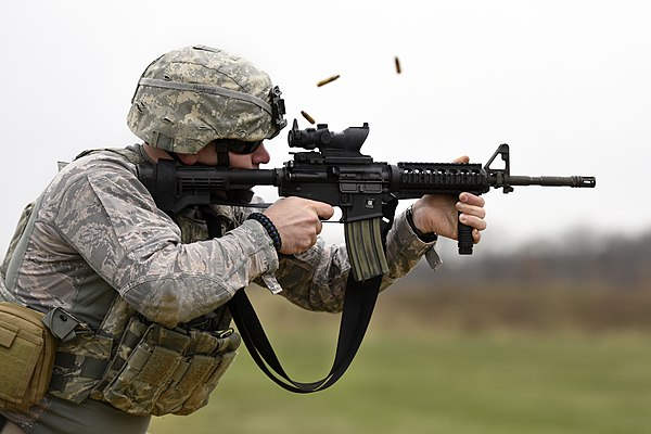 A Security Forces Airman of the Ohio Air National Guard fires an M4 carbine (a shorter and lighter variant of the M16A2 rifle) during target practice, 2017