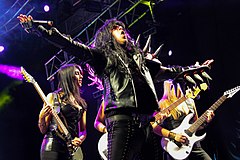 From left to right: Paulitchas Carregosa, Sutter and Isa Nielsen performing at a Detonator e as Musas do Metal concert in 2015