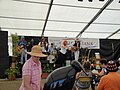 Singers, performing inside a marquee on the quay at Yarmouth Old Gaffers Festival, which takes place annually in June in Yarmouth, Isle of Wight.