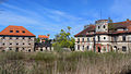 Čeština: Zámek Slavice v Slavicích, části Horních Kozolup. V pozadí kostel sv. Vavřince. English: Slavice castle in Slavice village, part of Horní Kozolupy, Czech Republic