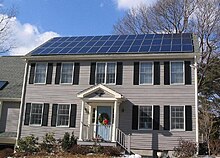 Photovoltaics on a house near Boston Solar panels on house roof winter view.jpg